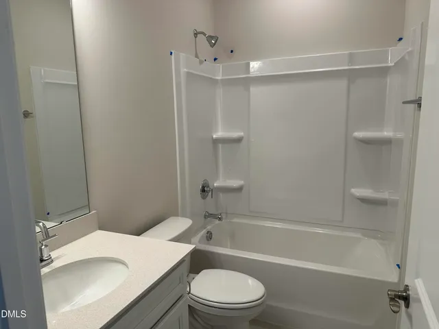 a bathroom with a sink a toilet and a bathtub
