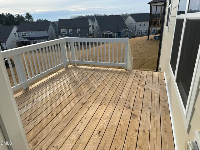 a view of balcony with wooden floor