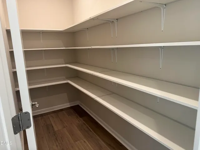 a view of an empty walk in closet