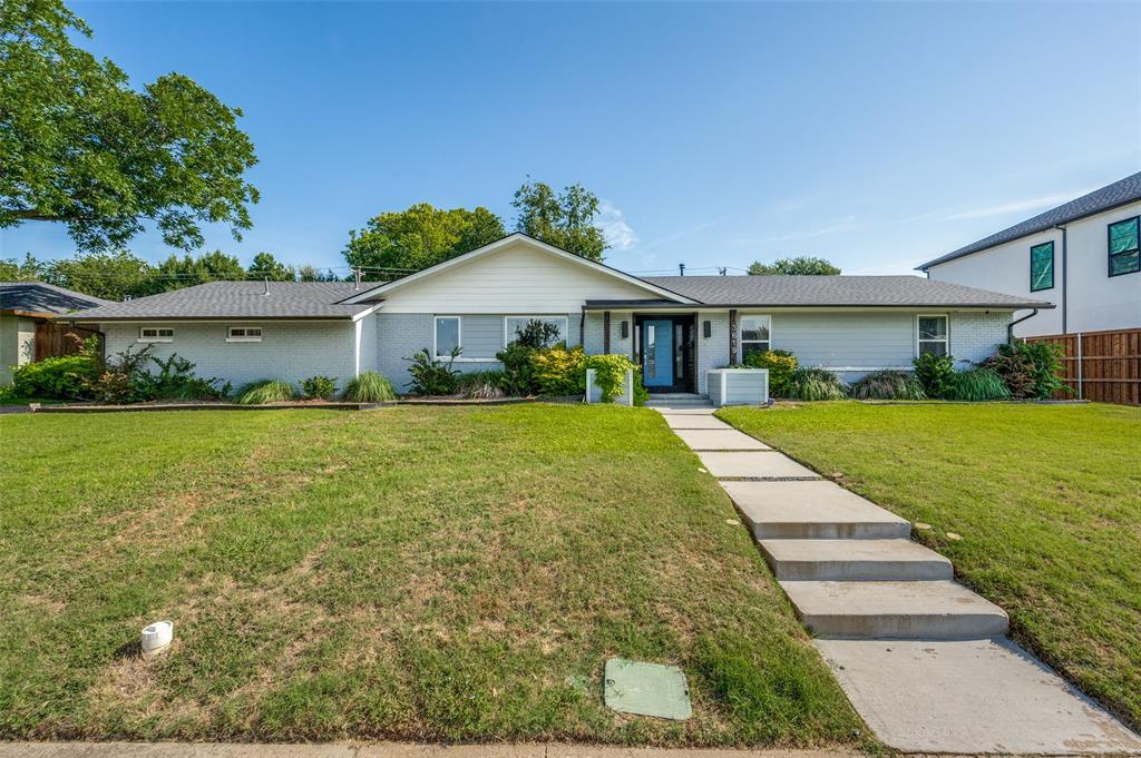 3619 Merrell Road Dallas, TX 75229 - Photo 2 of 26 Single-story residence featuring a light gray exterior with white trim, a dark gray shingled roof, a prominent front gable, and a vibrant blue entry door