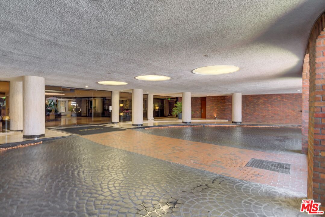 200 North Swall Drive, Unit PH6 Beverly Hills, CA 90211 - Photo 21 of 22 a view of an empty room with wooden floor