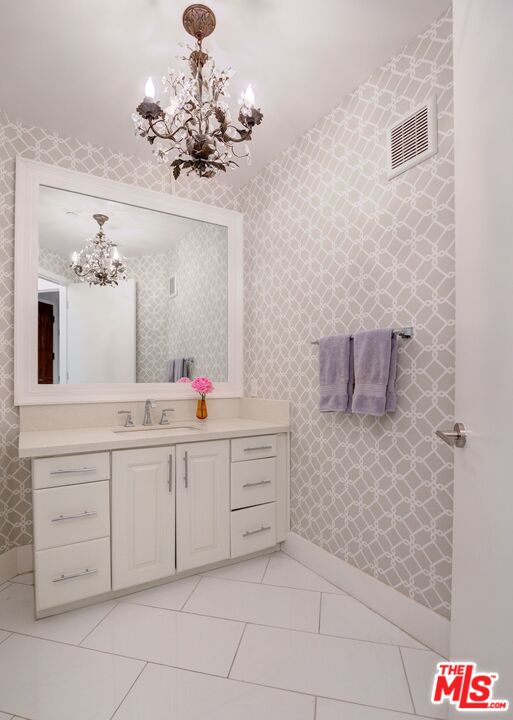 200 North Swall Drive, Unit PH6 Beverly Hills, CA 90211 - Photo 5 of 22 a spacious bathroom with a granite countertop sink a toilet and a mirror