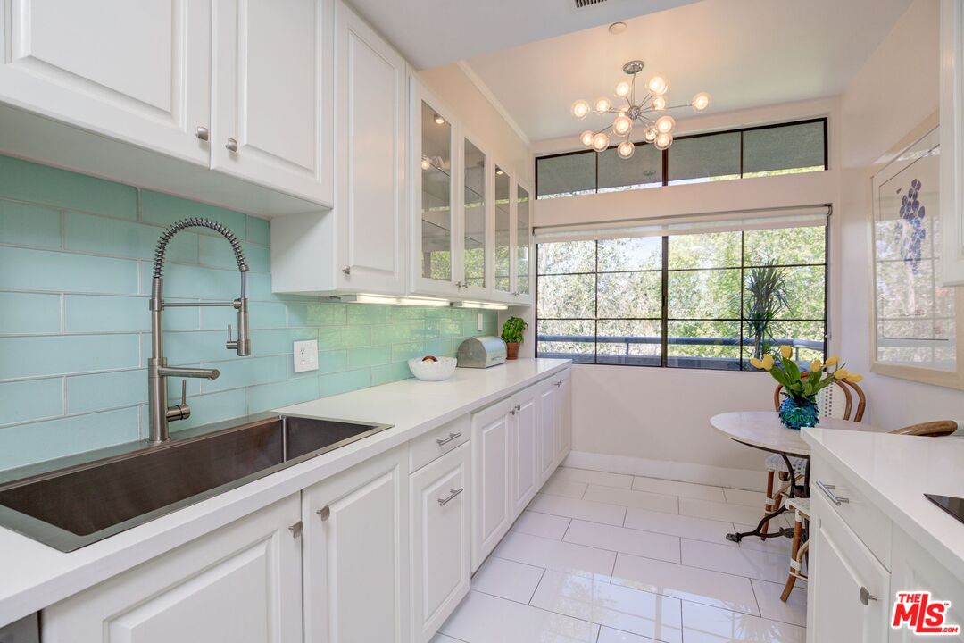 200 North Swall Drive, Unit PH6 Beverly Hills, CA 90211 - Photo 7 of 22 a kitchen with a sink cabinets and window