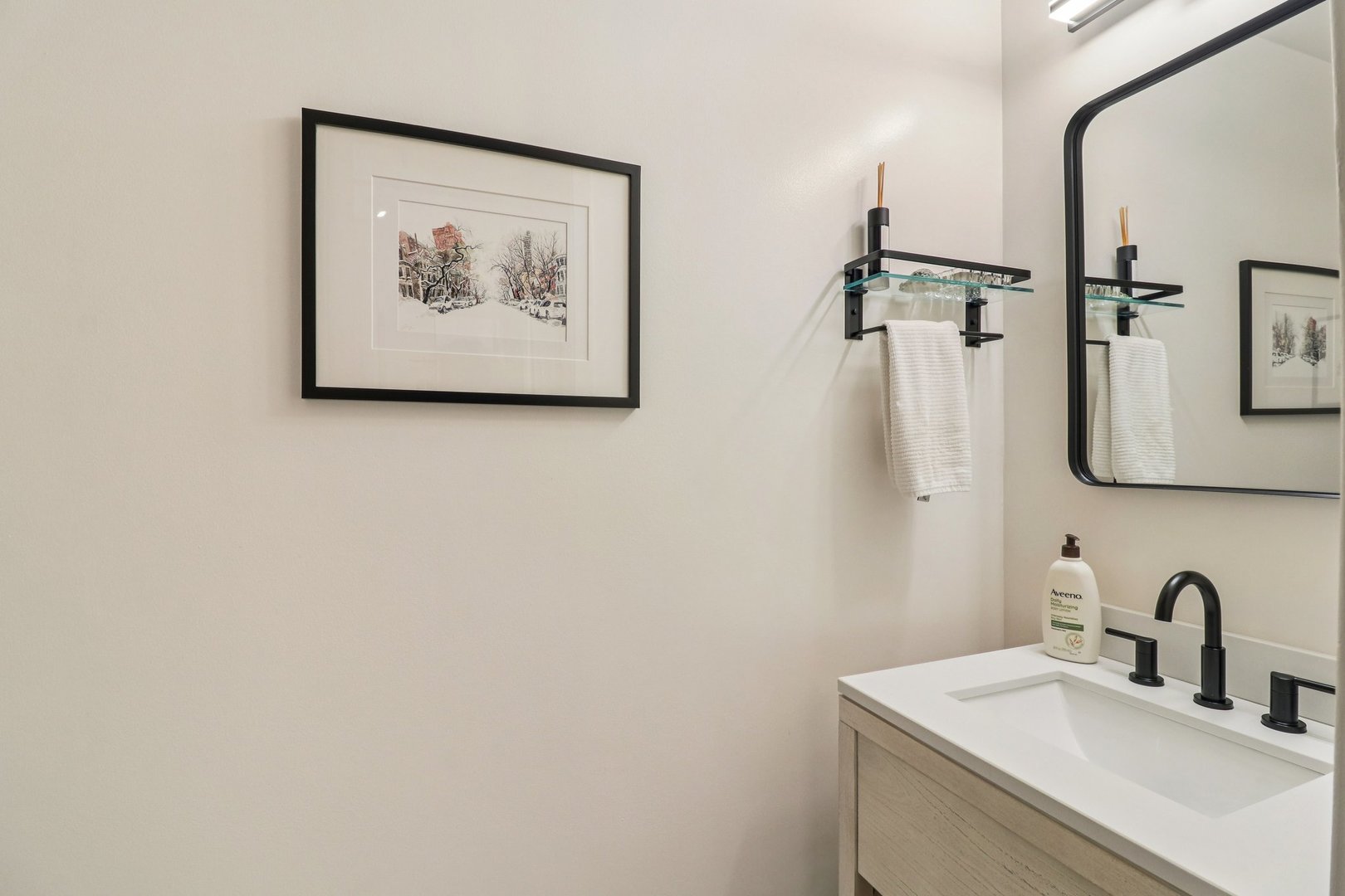 210 South Desplaines Street, Unit 304 Chicago, IL 60661 - Photo 11 of 19 a bathroom with a sink and a mirror
