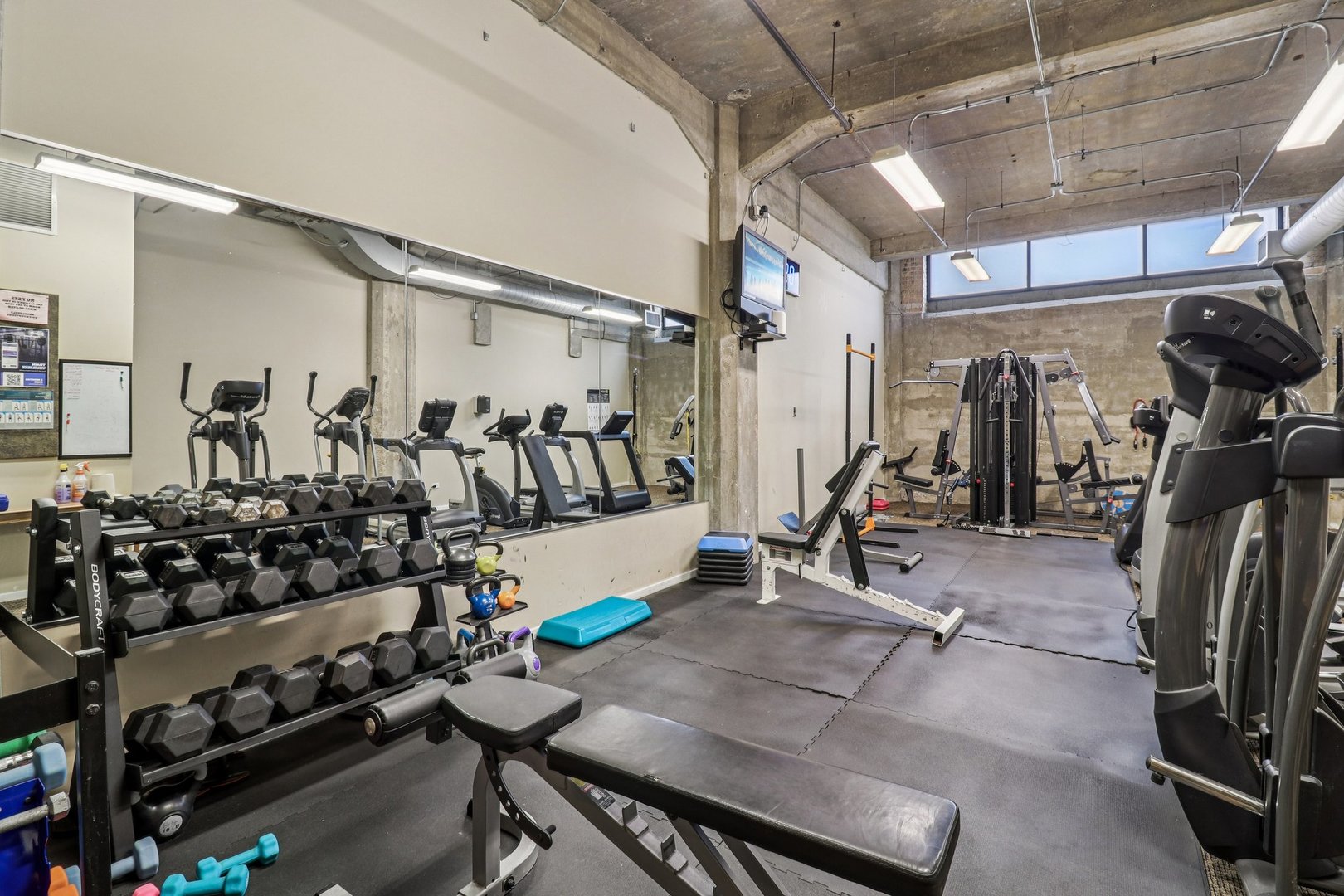 210 South Desplaines Street, Unit 304 Chicago, IL 60661 - Photo 12 of 19 a view of a room with gym equipment