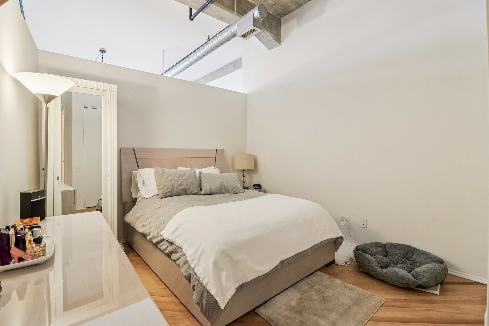 210 South Desplaines Street, Unit 304 Chicago, IL 60661 - Photo 6 of 19 a bedroom with a bed and window