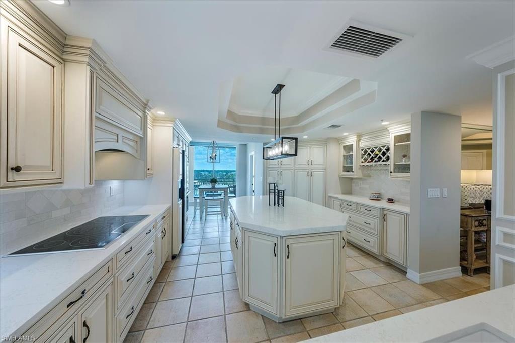 445 Dockside Drive, Unit B902 Naples, FL 34110 - Photo 13 of 29 a kitchen with stainless steel appliances granite countertop a sink and a refrigerator