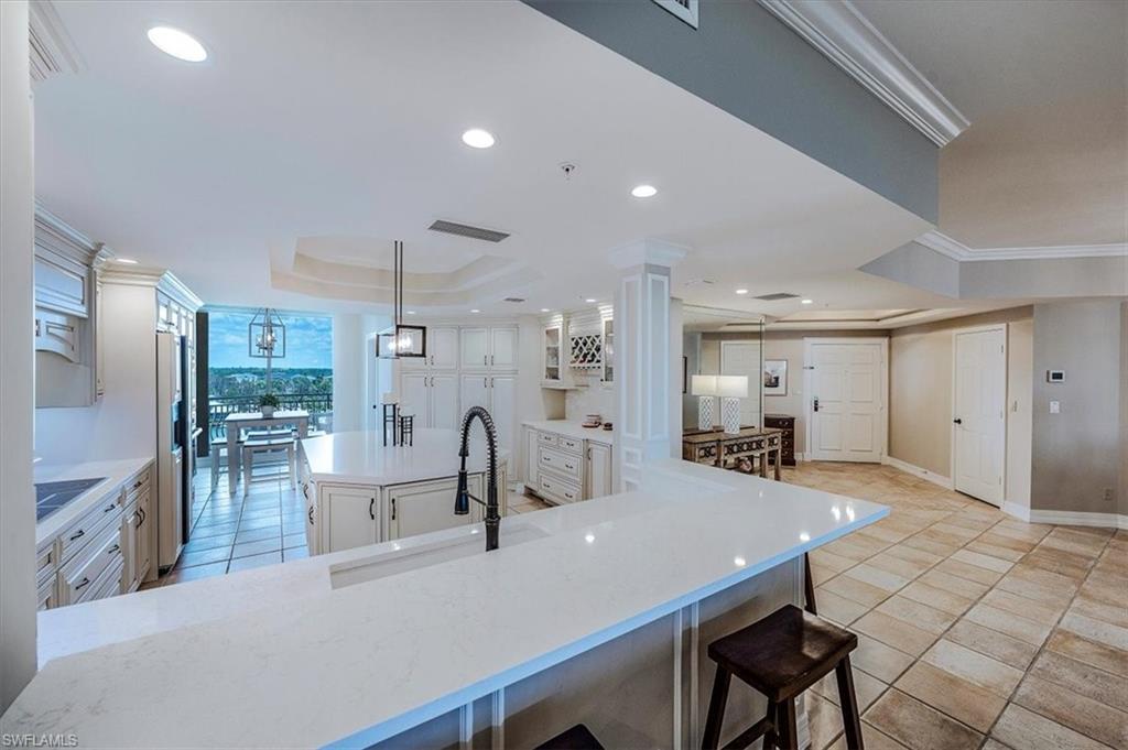 445 Dockside Drive, Unit B902 Naples, FL 34110 - Photo 18 of 29 a view of a kitchen and dining room