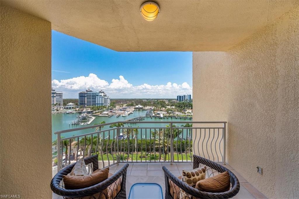 445 Dockside Drive, Unit B902 Naples, FL 34110 - Photo 21 of 29 a room with furniture and a floor to ceiling window
