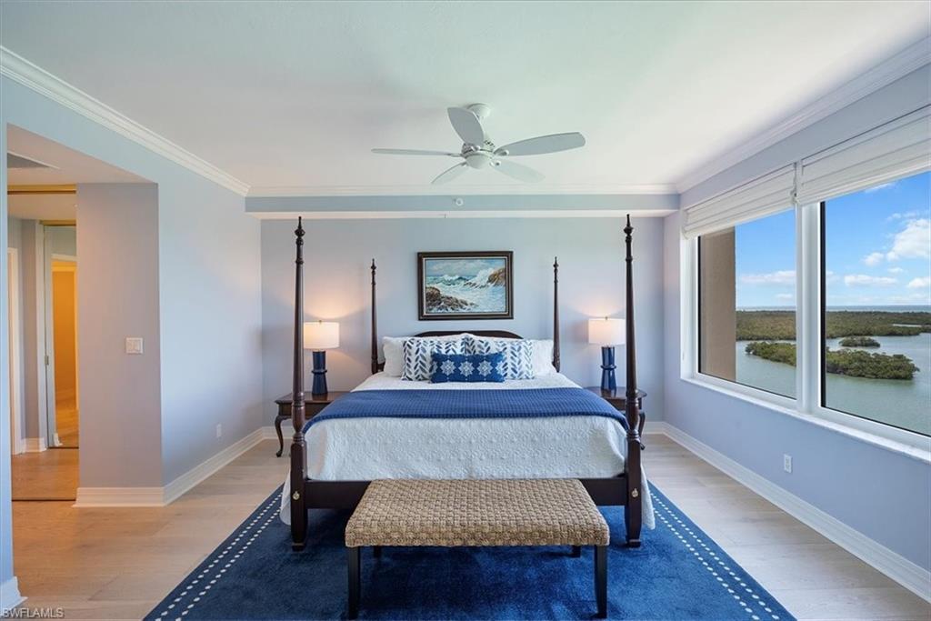 445 Dockside Drive, Unit B902 Naples, FL 34110 - Photo 23 of 29 a bed room with a bed and a large window