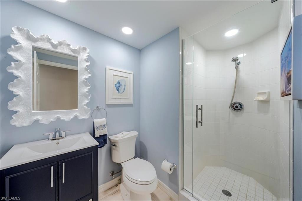 445 Dockside Drive, Unit B902 Naples, FL 34110 - Photo 24 of 29 a bathroom with a sink a toilet and shower