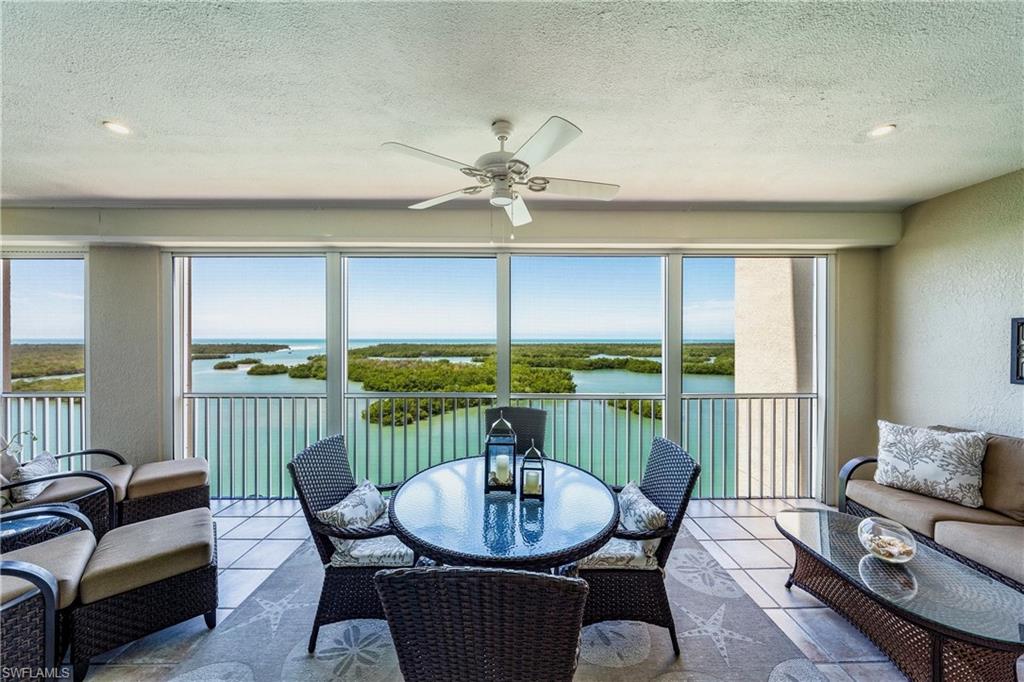 445 Dockside Drive, Unit B902 Naples, FL 34110 - Photo 6 of 29 a view of a dining room with furniture window and outside view
