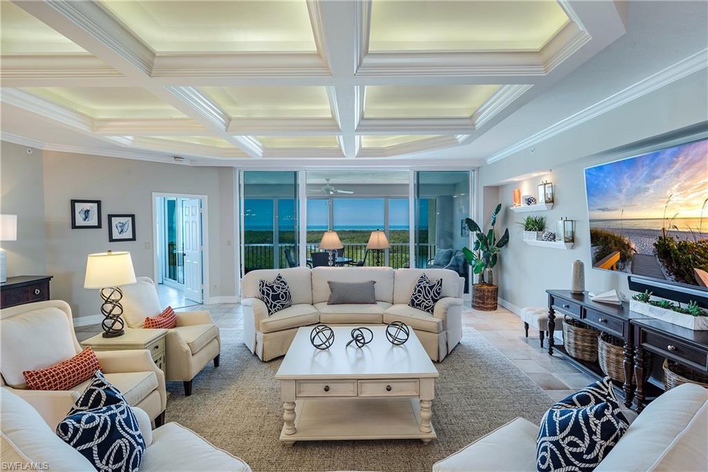 445 Dockside Drive, Unit B902 Naples, FL 34110 - Photo 7 of 29 a living room with furniture and a large window