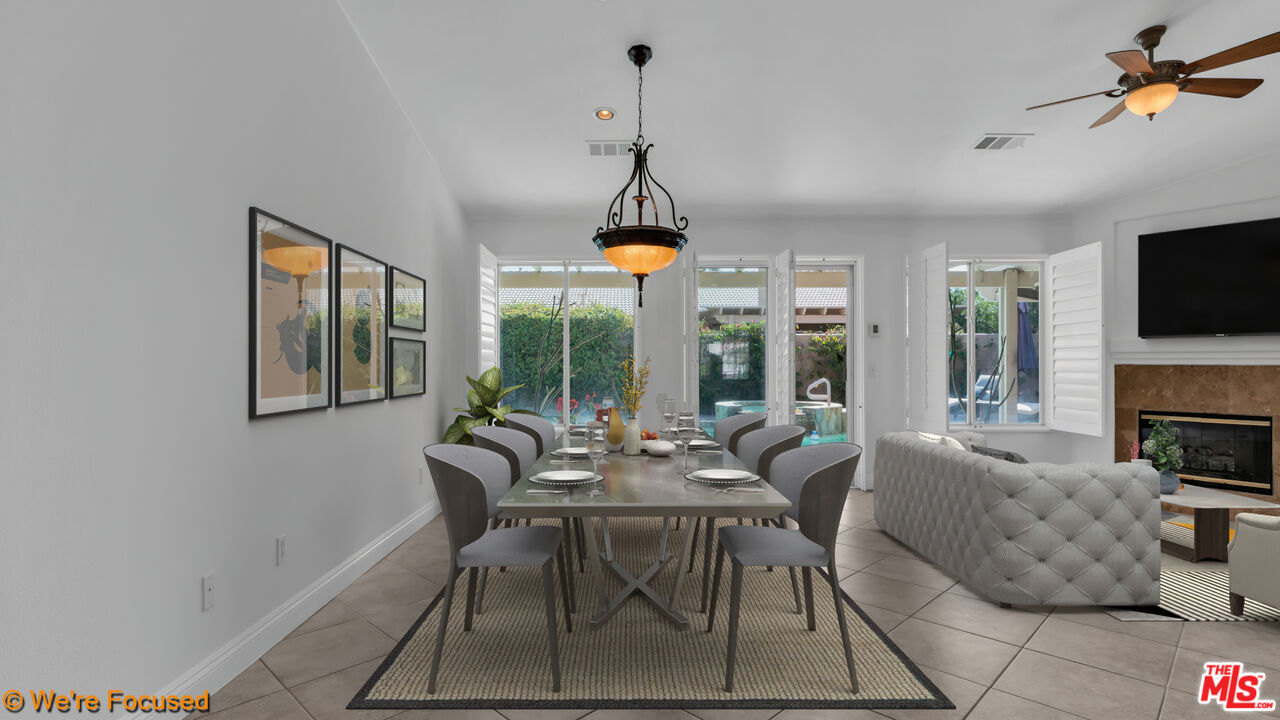 81129 La Reina Circle Indio, CA 92201 - Photo 14 of 46 a dining room with furniture a chandelier and window