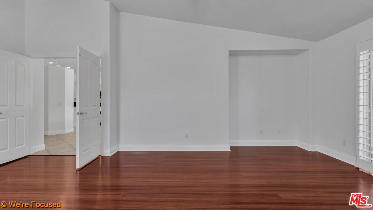 81129 La Reina Circle Indio, CA 92201 - Photo 23 of 46 a view of wooden floor and windows in a room