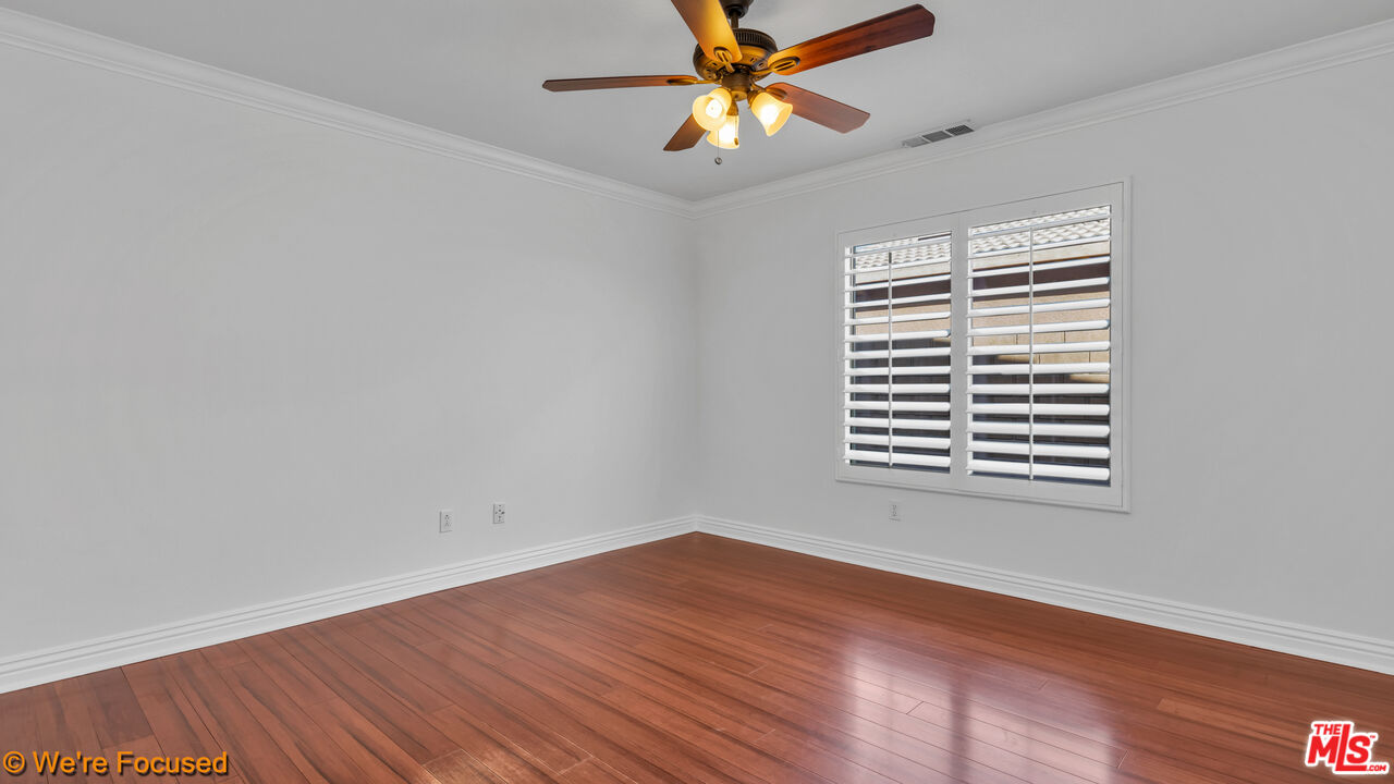 81129 La Reina Circle Indio, CA 92201 - Photo 27 of 46 wooden floor in an empty room with a window