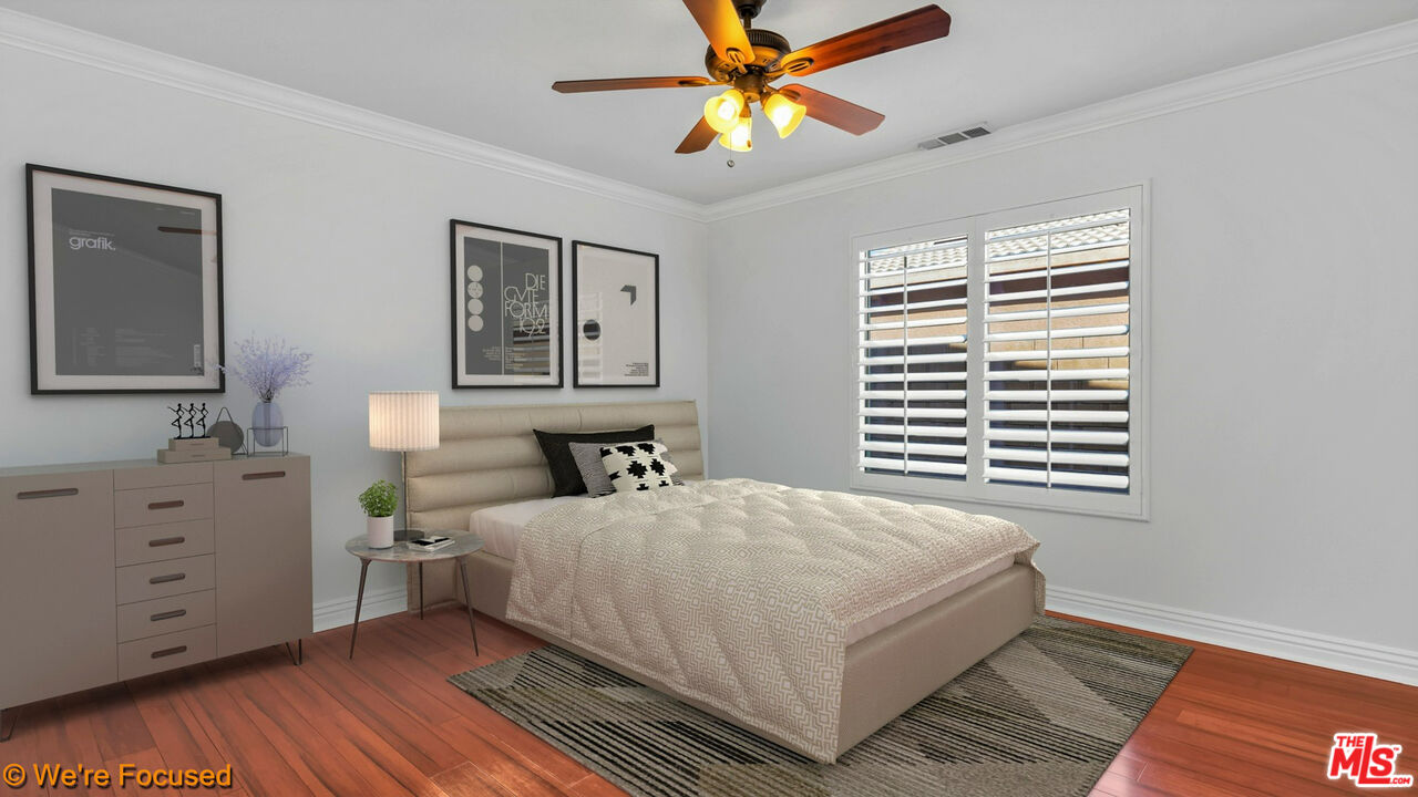 81129 La Reina Circle Indio, CA 92201 - Photo 28 of 46 a bedroom with a bed and a window