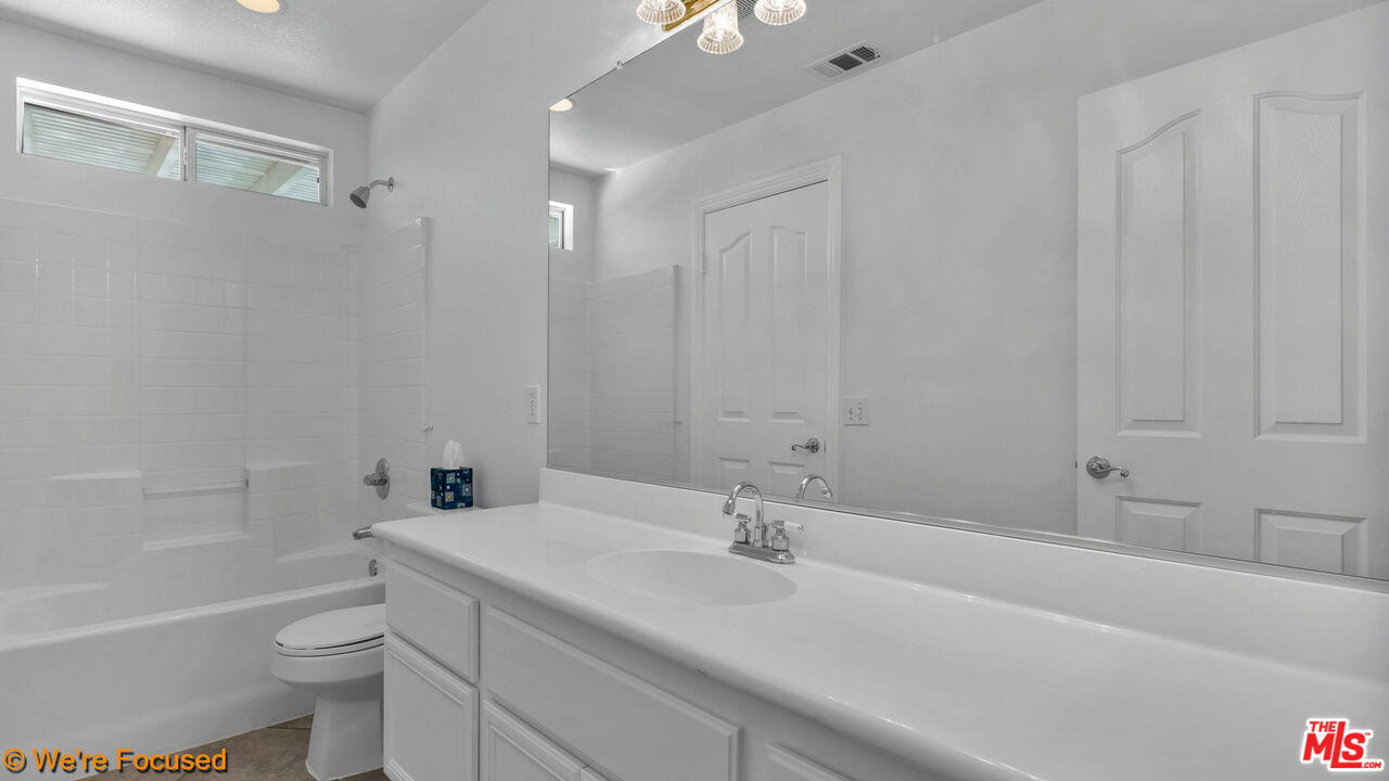 81129 La Reina Circle Indio, CA 92201 - Photo 30 of 46 a bathroom with a sink a toilet and shower