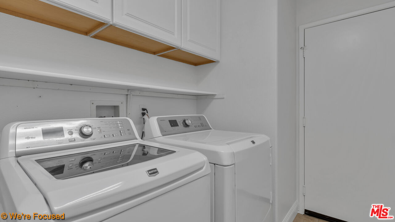 81129 La Reina Circle Indio, CA 92201 - Photo 31 of 46 a utility room with dryer and washer