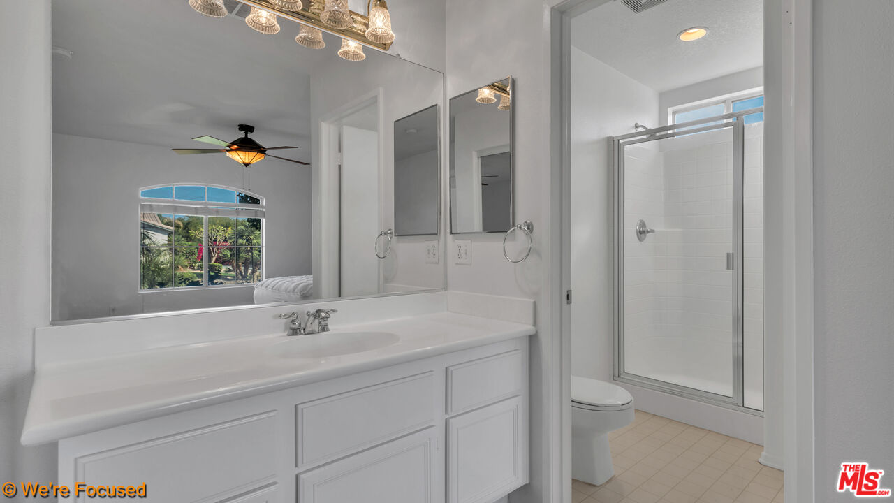 81129 La Reina Circle Indio, CA 92201 - Photo 33 of 46 a bathroom with a sink and a mirror