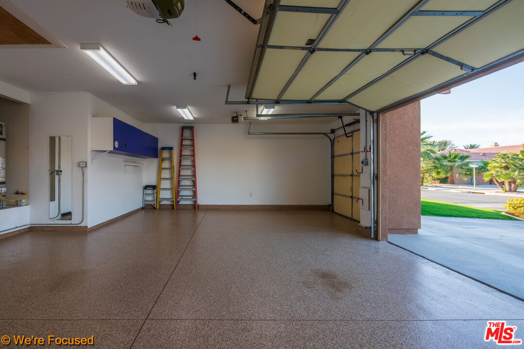 81129 La Reina Circle Indio, CA 92201 - Photo 34 of 46 a view of empty room with wooden floor and windows