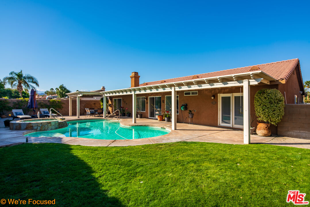 81129 La Reina Circle Indio, CA 92201 - Photo 37 of 46 a view of house with a backyard porch and sitting area