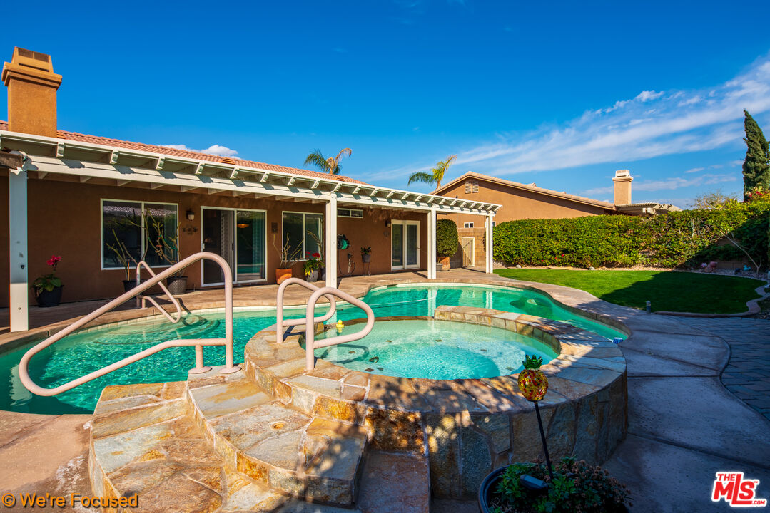 81129 La Reina Circle Indio, CA 92201 - Photo 40 of 46 a view of a house with swimming pool and porch