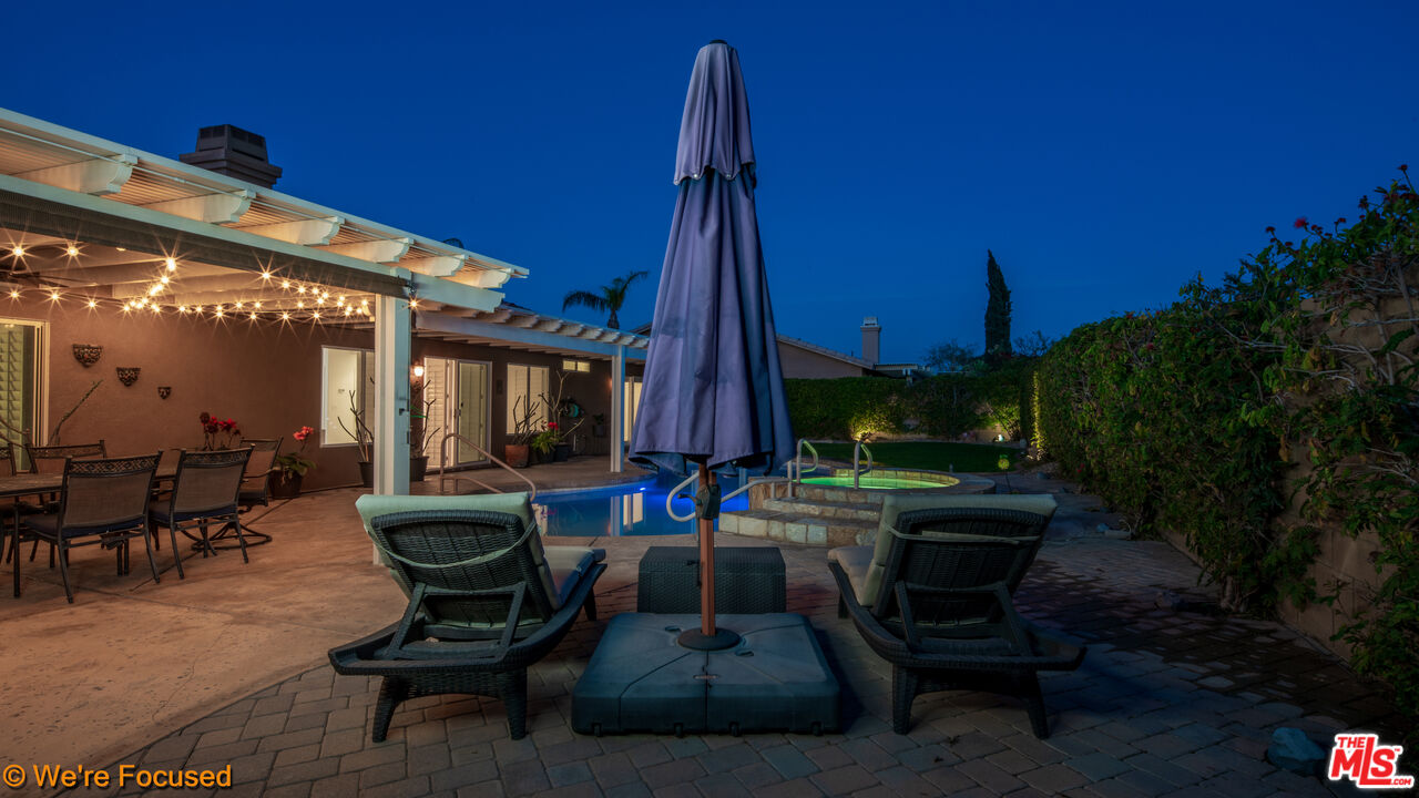 81129 La Reina Circle Indio, CA 92201 - Photo 43 of 46 a view of a patio with a table and chairs and potted plants