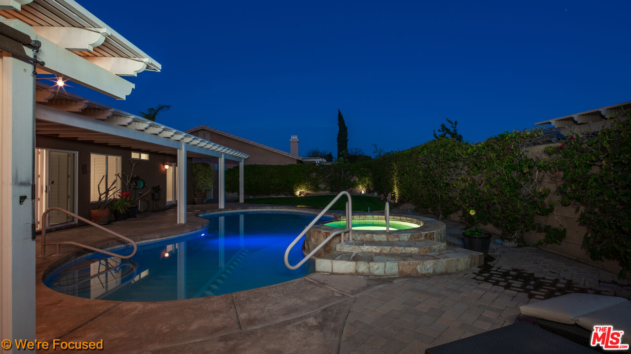 81129 La Reina Circle Indio, CA 92201 - Photo 44 of 46 a view of a house with swimming pool and porch with furniture