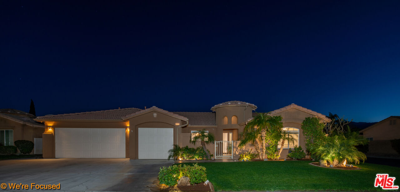 81129 La Reina Circle Indio, CA 92201 - Photo 46 of 46 a front view of a house with garden