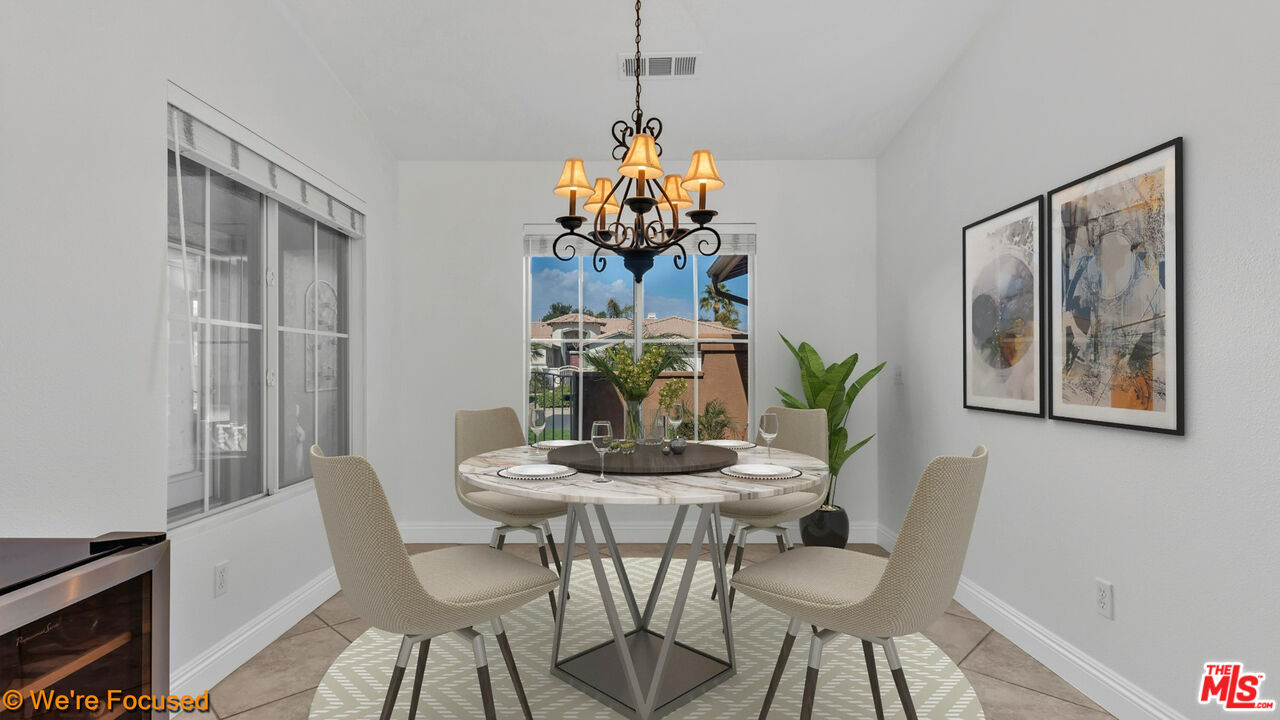 81129 La Reina Circle Indio, CA 92201 - Photo 10 of 46 a dining room with furniture and window