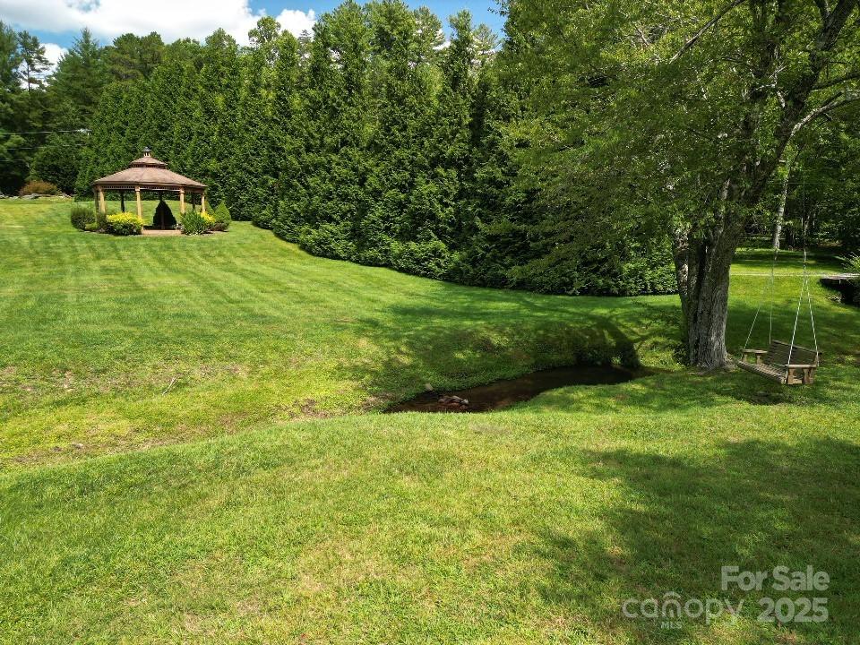 117 Sovereign Lane Fairview, NC 28730 - Photo 19 of 41 a view of a garden with a slide