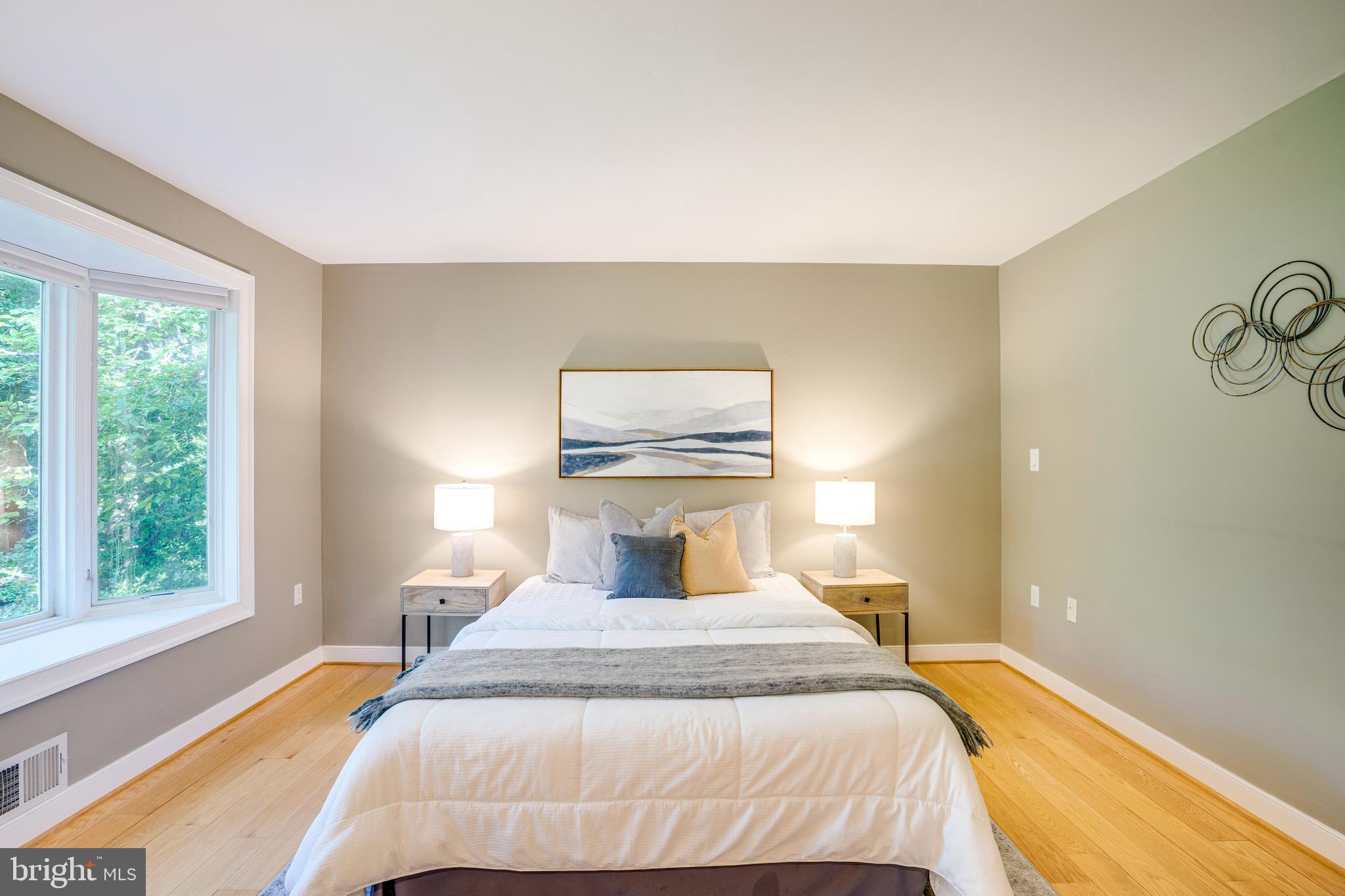 2603 Penny Royal Lane Reston, VA 20191 - Photo 12 of 72 a bedroom with a bed and wooden floor