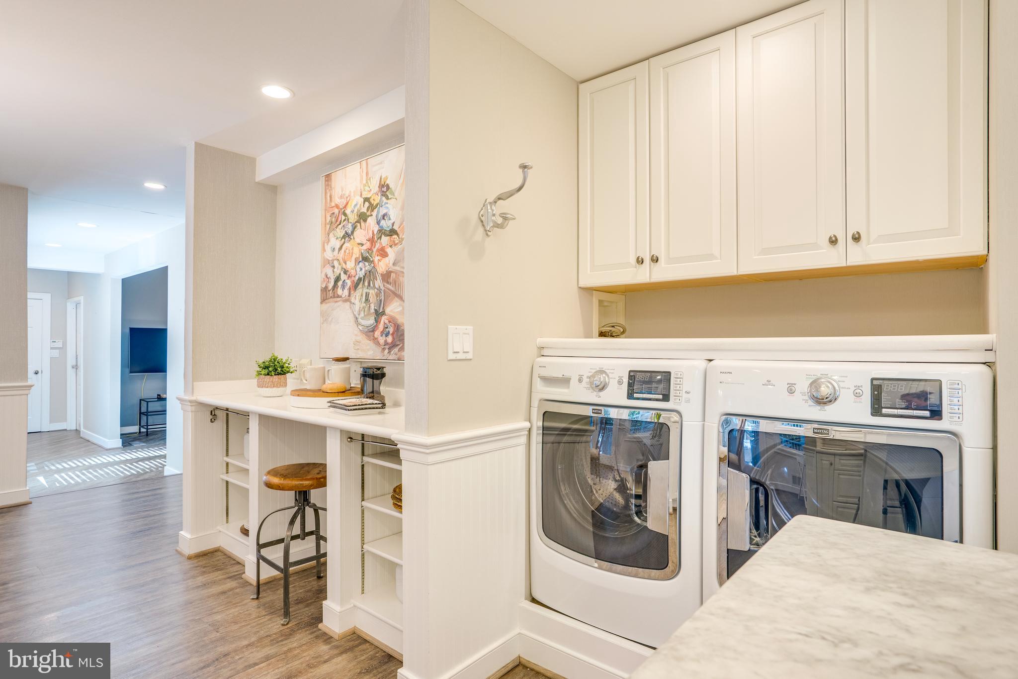 2603 Penny Royal Lane Reston, VA 20191 - Photo 16 of 72 a kitchen with a refrigerator and white cabinets