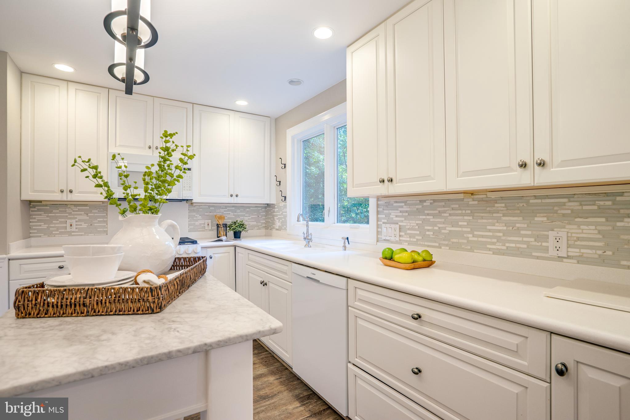 2603 Penny Royal Lane Reston, VA 20191 - Photo 26 of 72 a kitchen with a sink a counter cabinets and appliances