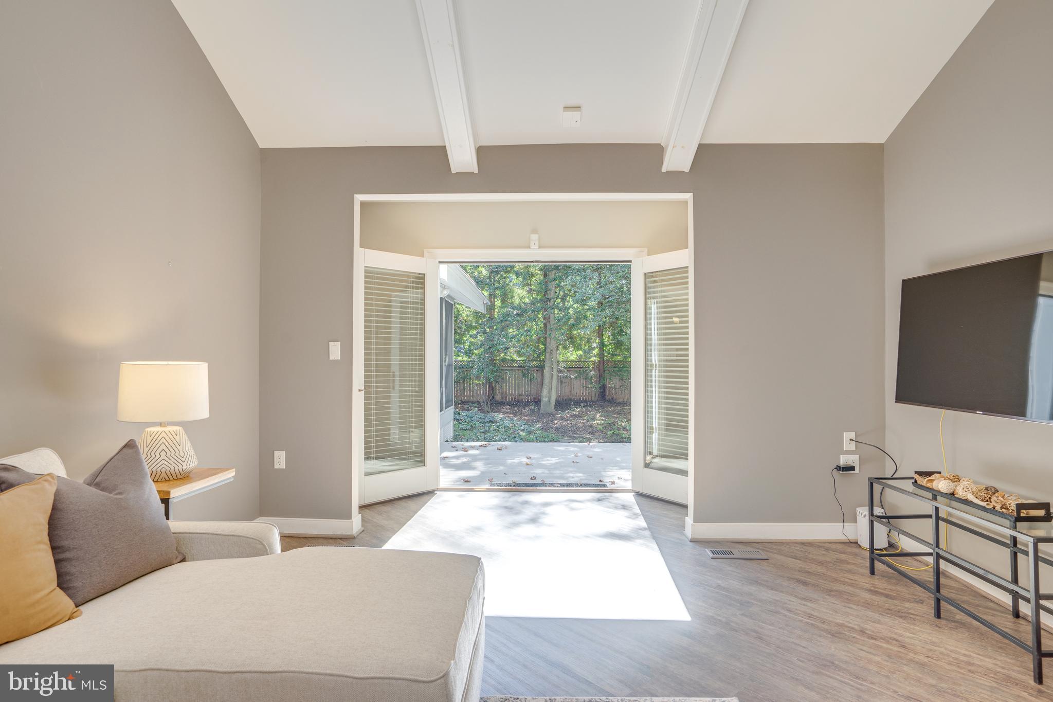 2603 Penny Royal Lane Reston, VA 20191 - Photo 44 of 72 a living room with furniture and a flat screen tv