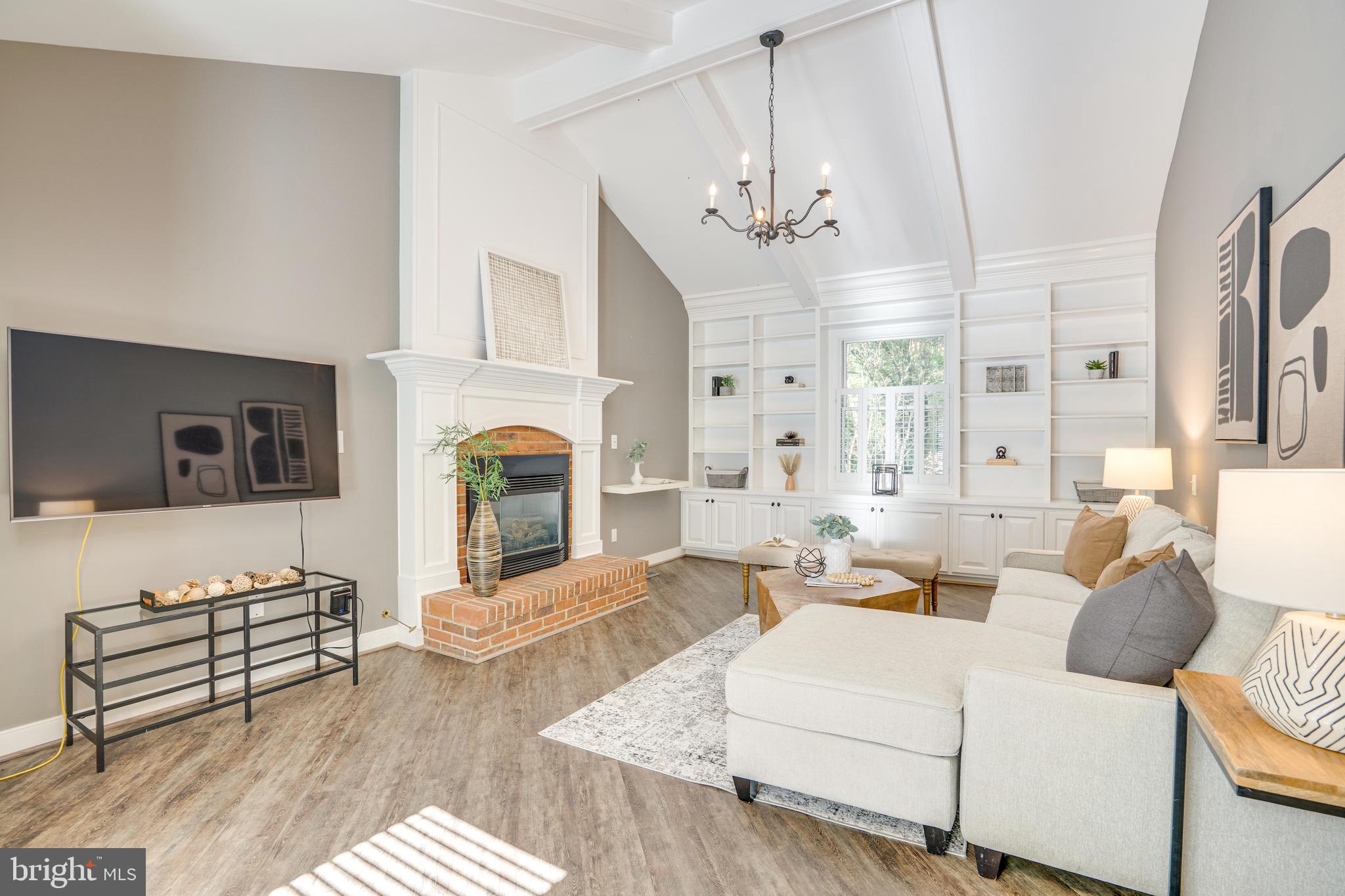2603 Penny Royal Lane Reston, VA 20191 - Photo 47 of 72 a living room with fireplace furniture and a chandelier