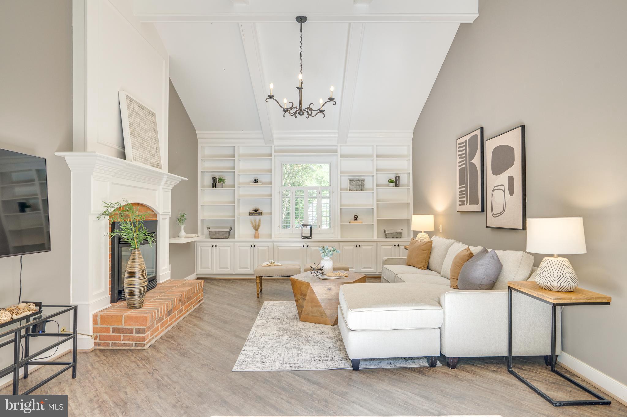 2603 Penny Royal Lane Reston, VA 20191 - Photo 50 of 72 a living room with furniture and a chandelier