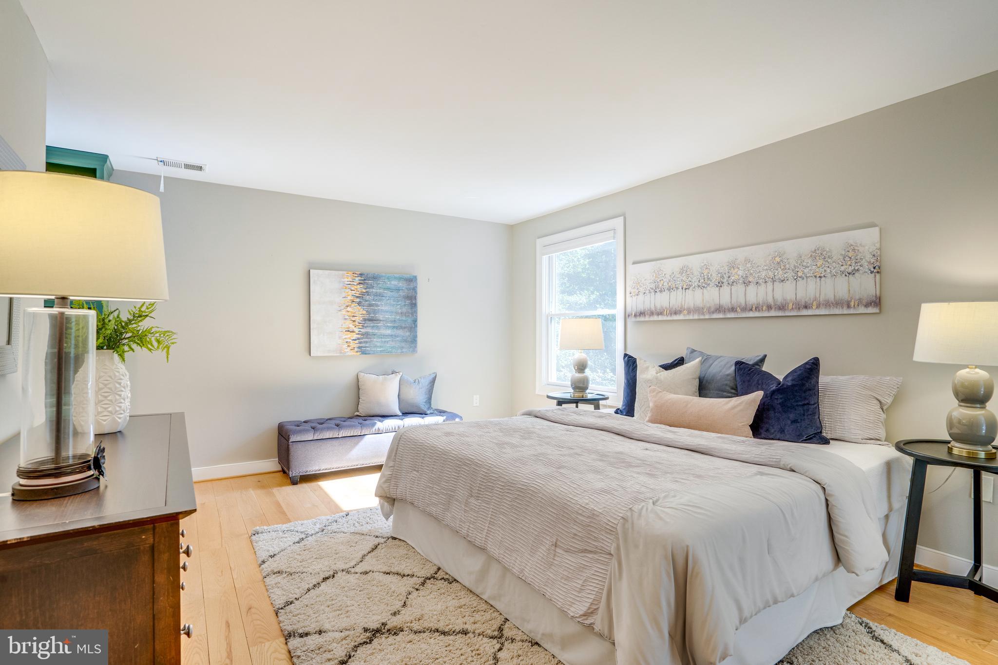 2603 Penny Royal Lane Reston, VA 20191 - Photo 57 of 72 a bedroom with a bed lamp on desk and a window