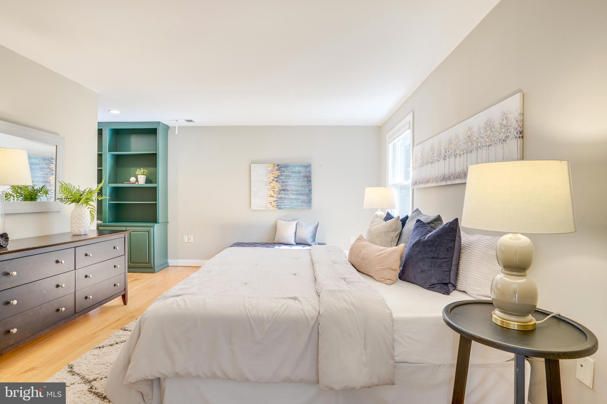 2603 Penny Royal Lane Reston, VA 20191 - Photo 60 of 72 a bedroom with a bed and a dresser