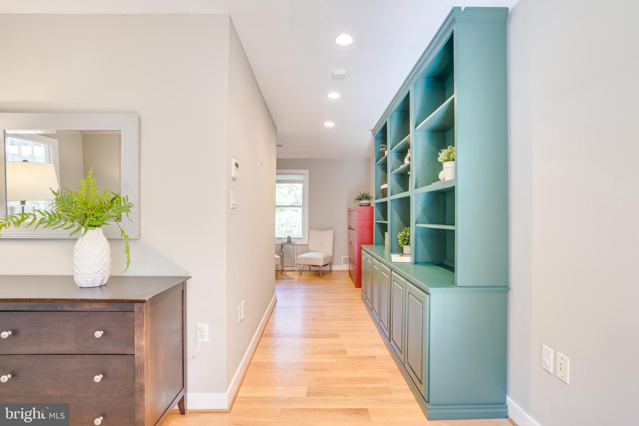 2603 Penny Royal Lane Reston, VA 20191 - Photo 64 of 72 a hallway with cabinets and wooden floor