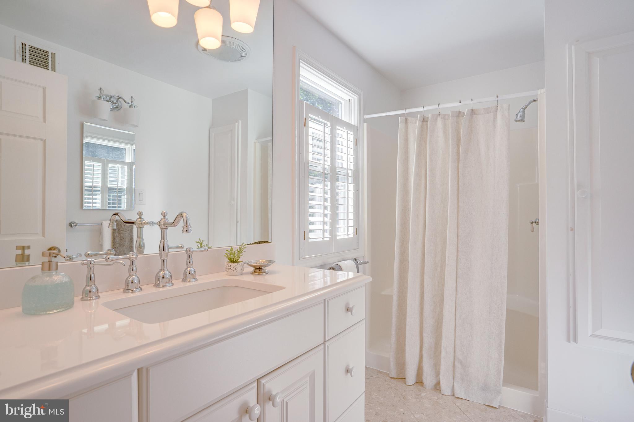 2603 Penny Royal Lane Reston, VA 20191 - Photo 65 of 72 a bathroom with 2 sink and a mirror