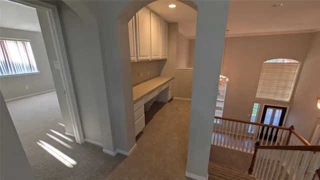 a view of entryway and hall with a window