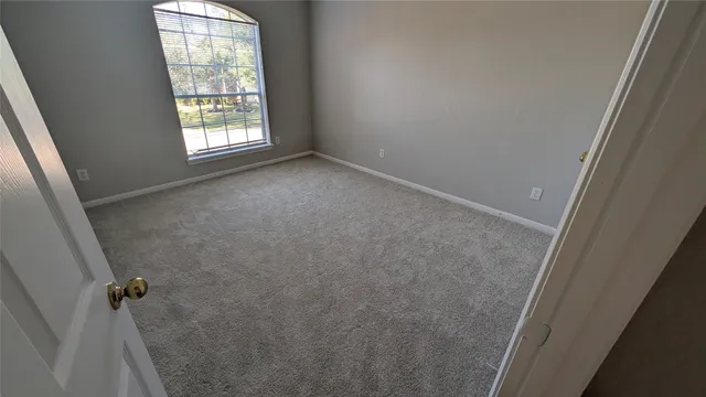 a view of a hallway with staircase