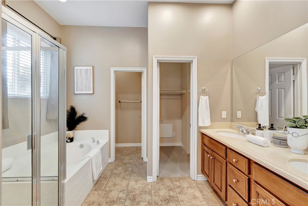 3405 South Main Street, Unit D Santa Ana, CA 92707 - Photo 16 of 30 a spacious bathroom with a bathtub sink and mirror
