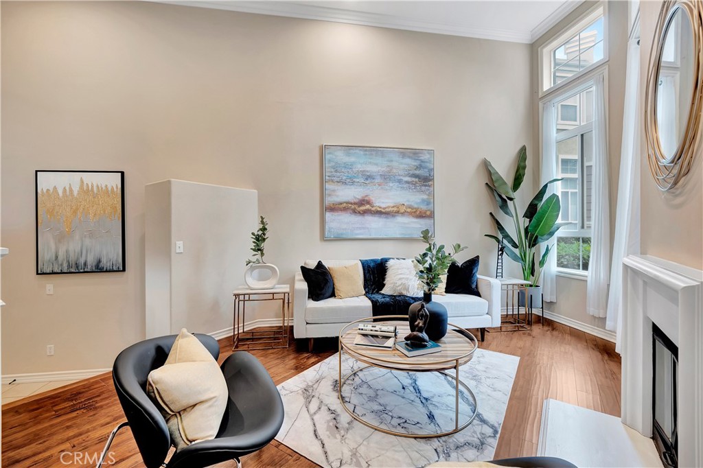 3405 South Main Street, Unit D Santa Ana, CA 92707 - Photo 2 of 30 a living room with furniture potted plant and a fireplace