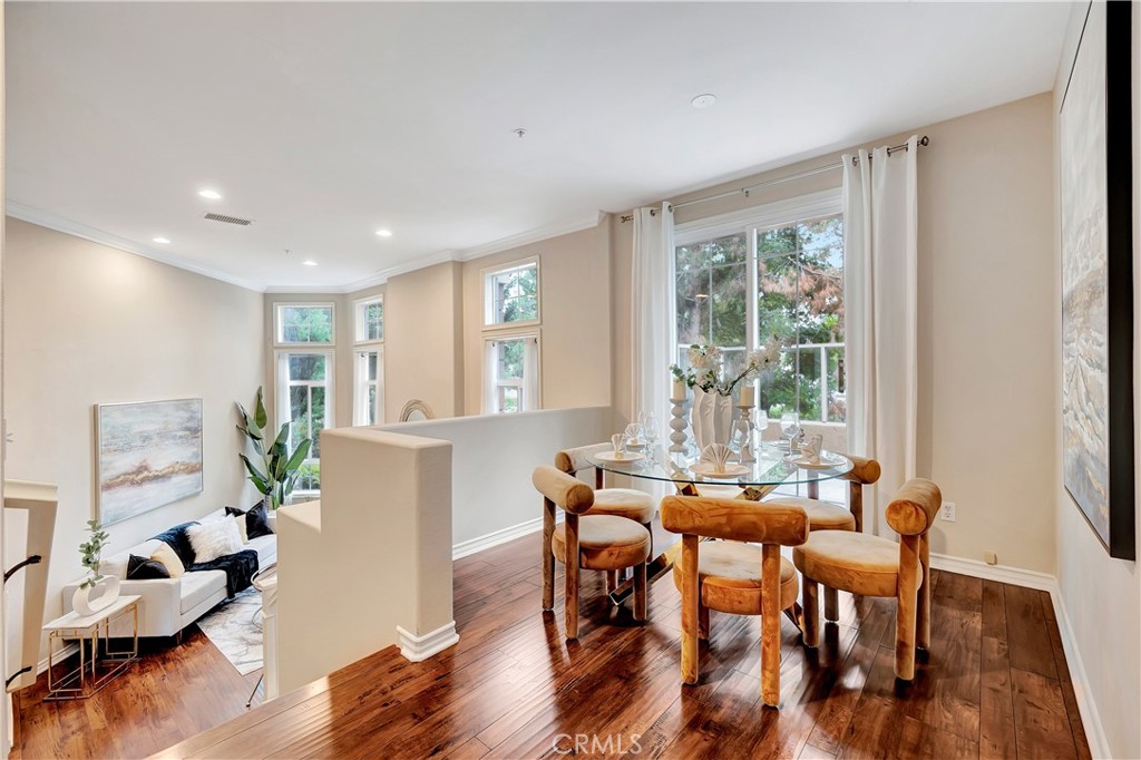 3405 South Main Street, Unit D Santa Ana, CA 92707 - Photo 5 of 30 a view of a dining room with furniture window and wooden floor