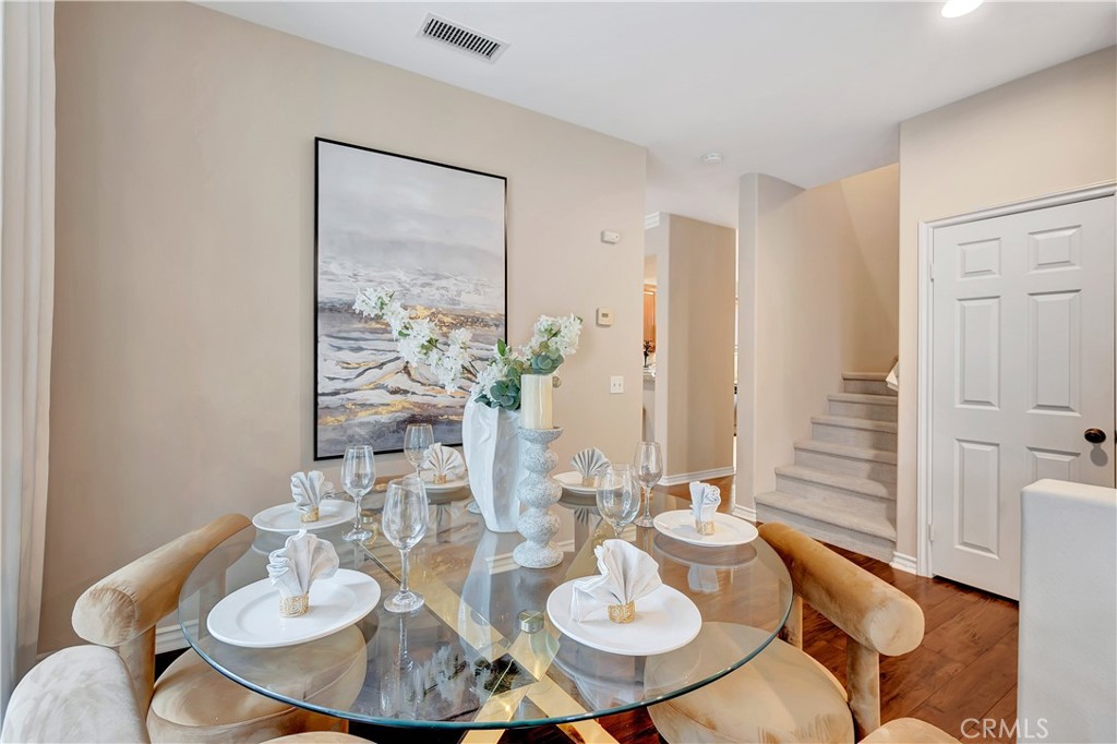 3405 South Main Street, Unit D Santa Ana, CA 92707 - Photo 6 of 30 a dining room with furniture and wooden floor