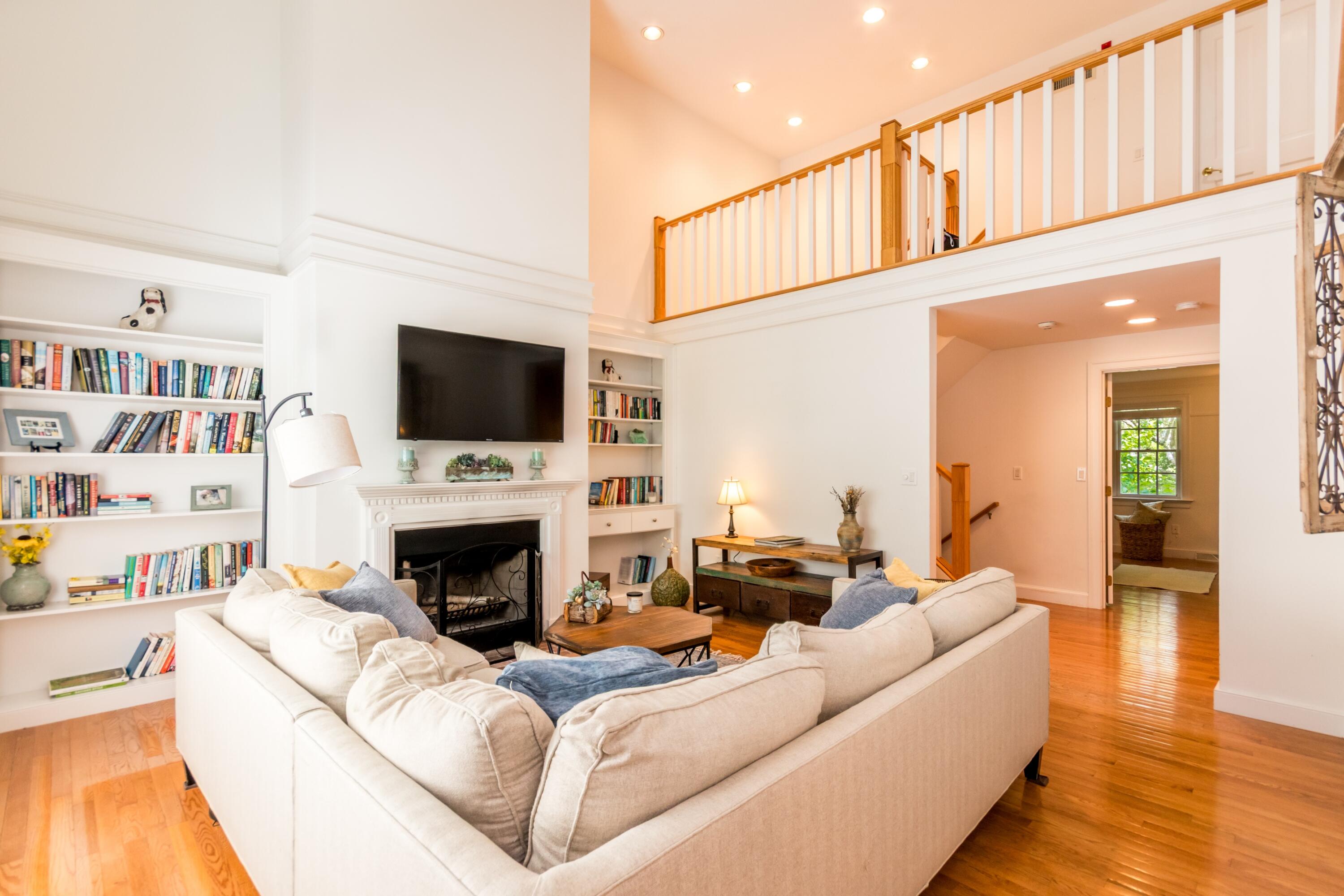 15 Hampton Court, Unit 15 Mashpee, MA 02649 - Photo 15 of 40 a living room with fireplace furniture and a flat screen tv