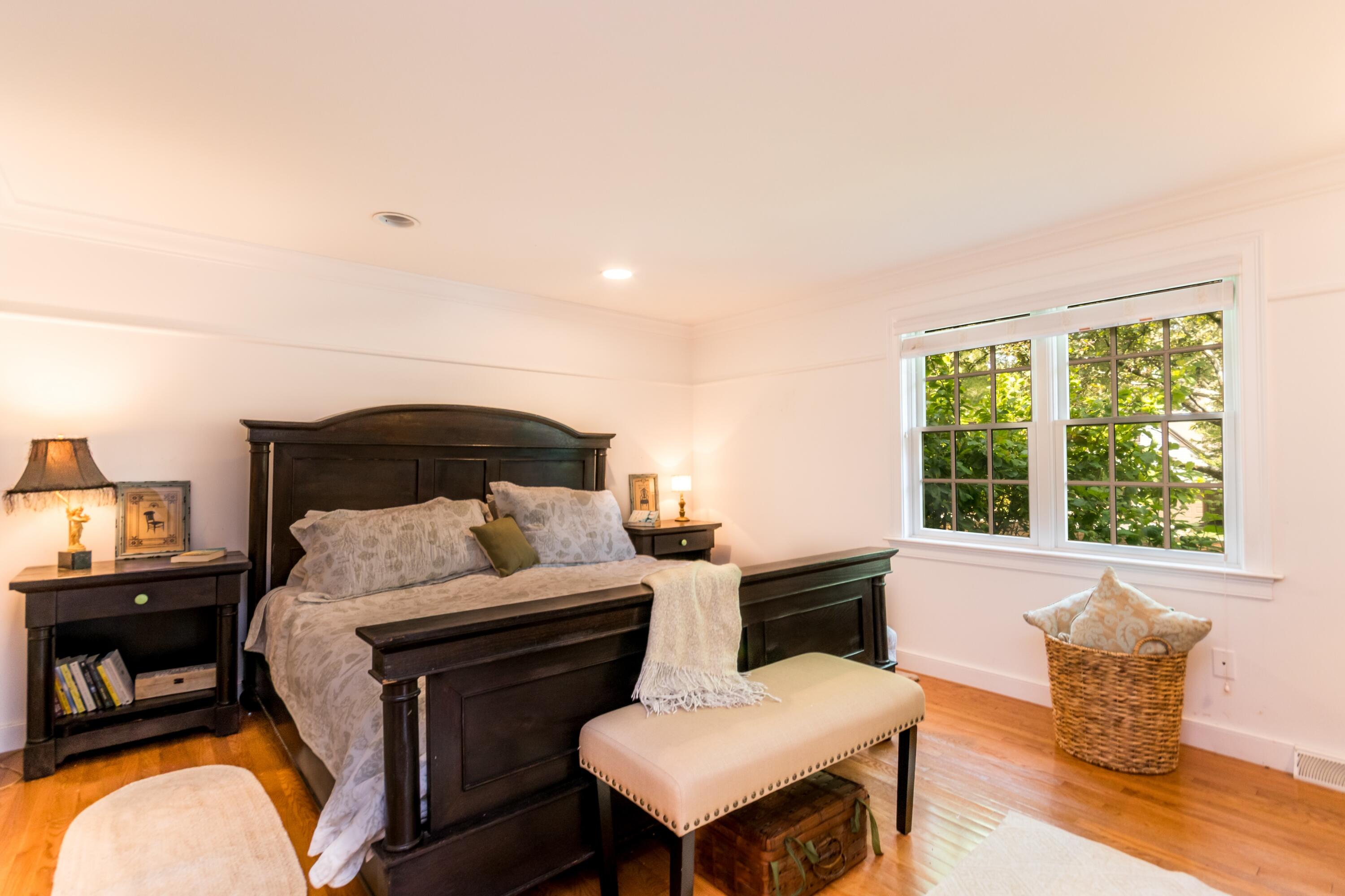 15 Hampton Court, Unit 15 Mashpee, MA 02649 - Photo 19 of 40 a bedroom with a bed and a couch